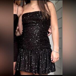 Elegant black sequin short dress, flattering fit, flare silhouette, drop waist.